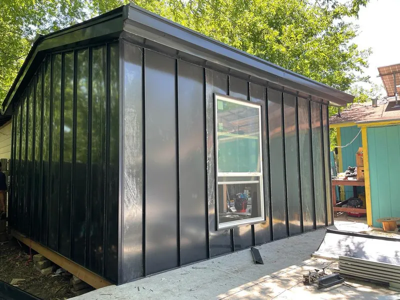 Black standing seam metal wall panels for Metal Roof Installation in East Bethel