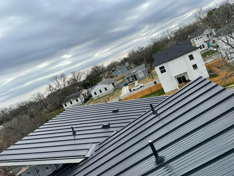 Standing seam metal roof panels with vents for Skylight Repair in East Bethel